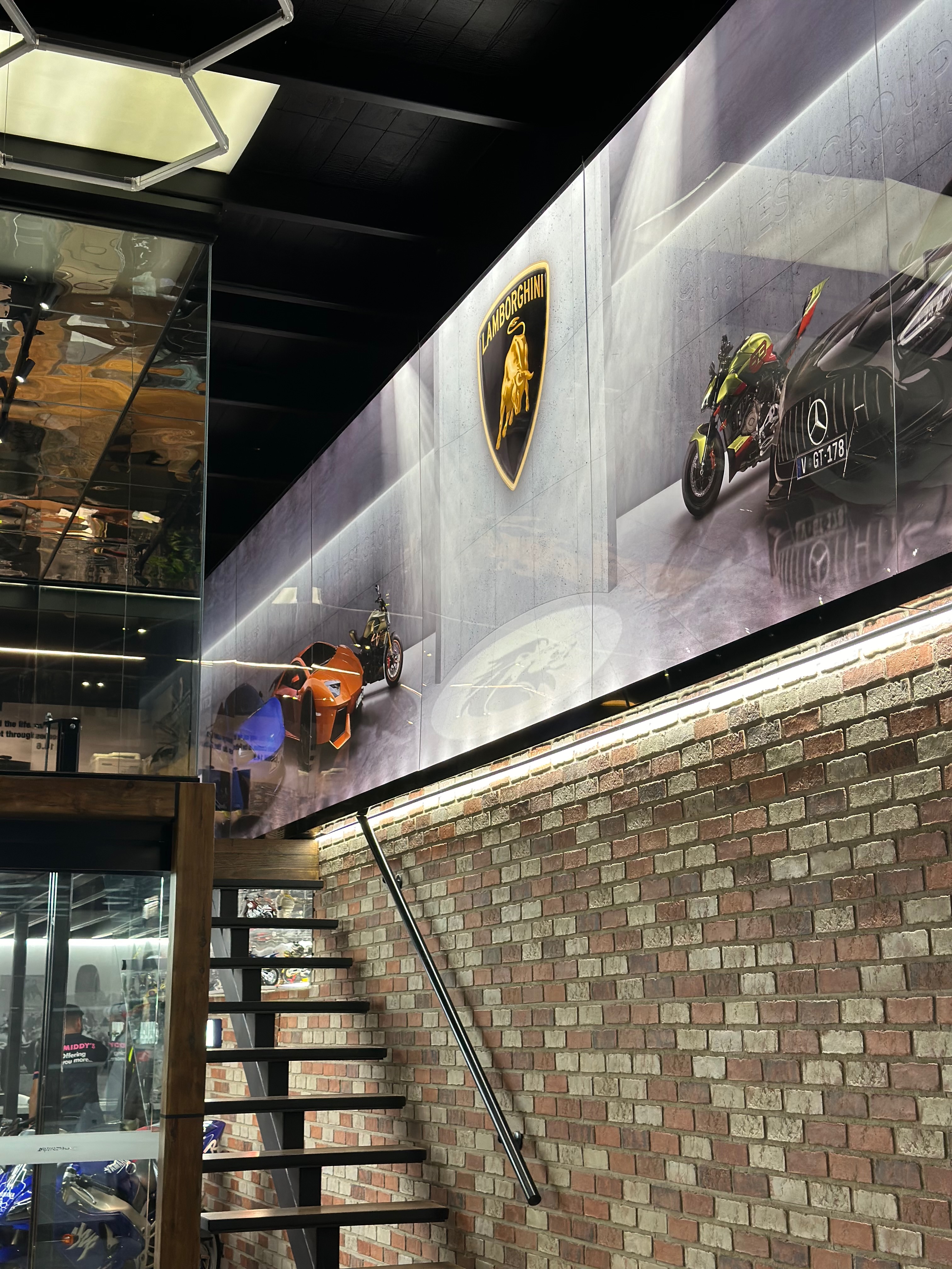 Lamborghini logo and brand imagery on illuminated wall